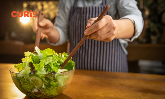 A Vibrant Mix of Pasta and Seasonal Vegetables Tossed in Basil Pesto Sauce